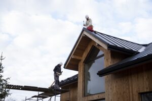 long-shot-men-working-roof-min